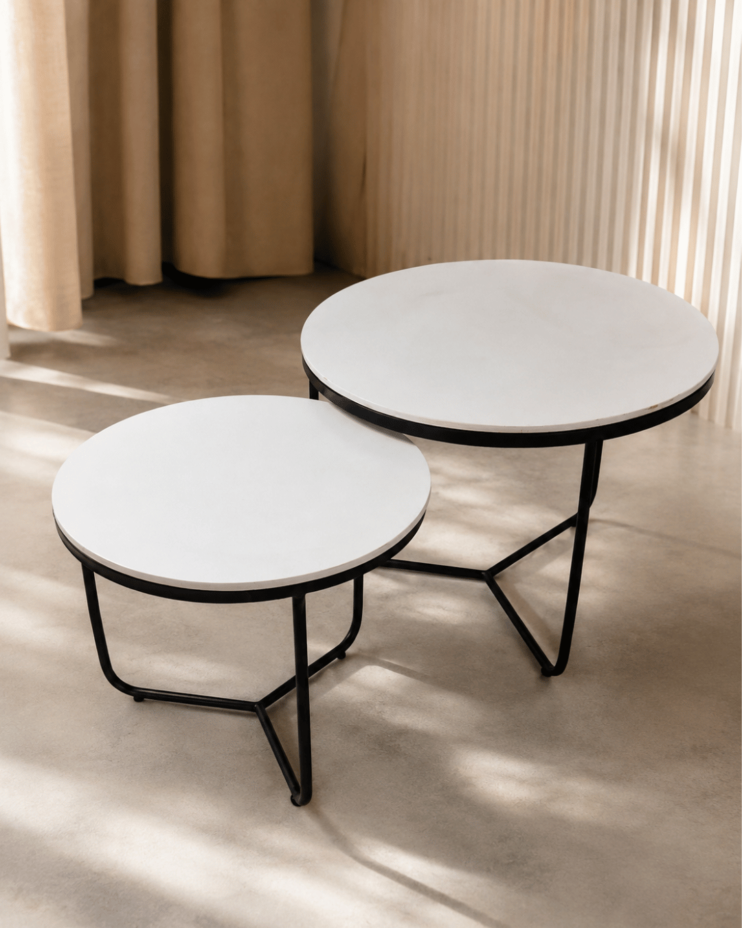 Round White Top Nesting Coffee Tables with Black Tripod Metal Legs (Set of 2)